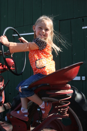 Rachel on a farm tractor - October festivities