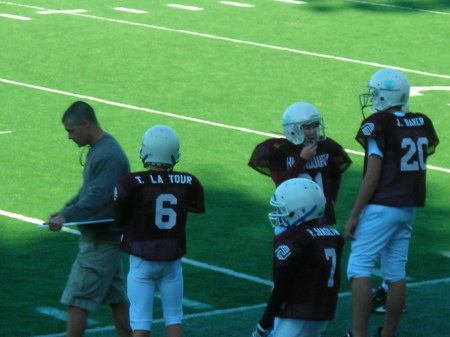 Coaching at son's football game