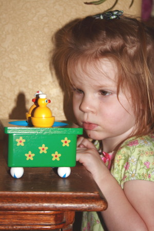 Molly Enthralled by a music box