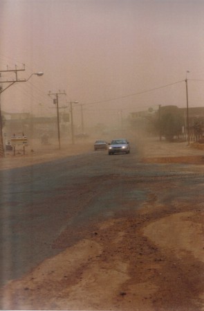 Midday dust storm main st Coober Pedy