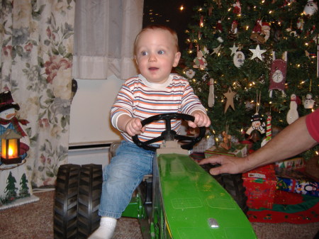 Ky with his new John Deere tractor!