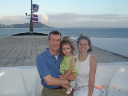 Ryan, Jamie, and Em on a ship in Hawaii.