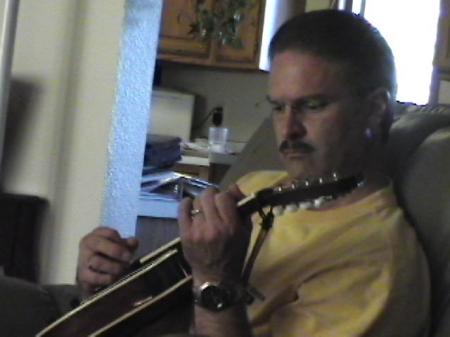 Pluckin away on the mandolin