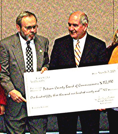 The Gov Presenting a Grant Check