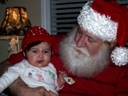 Great granddaughter, with Santa (my husband)