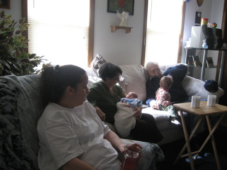 Grandparents at my house holding Brendan