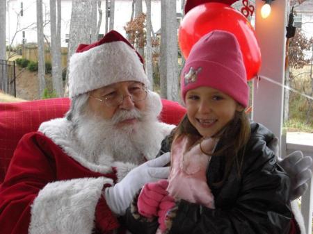 My daughter, Emily with Santa 2008