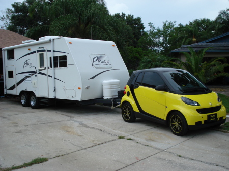 SON'S SMART CAR AND OUR TRAVEL TRAILER