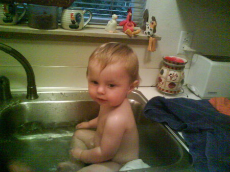 joe taking a bath in grammies sink.