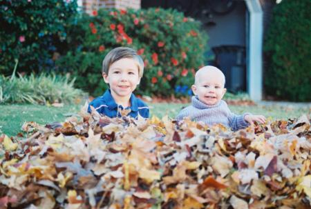 Carter and Eva in the Fall leaves.