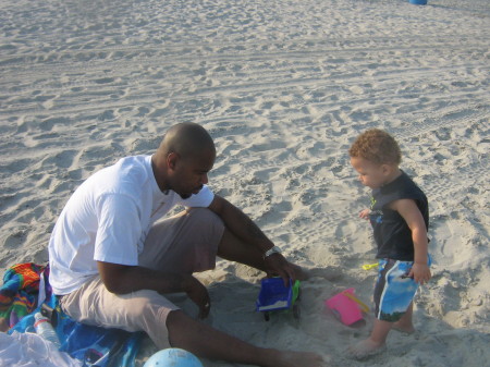 son and grandson at the beach