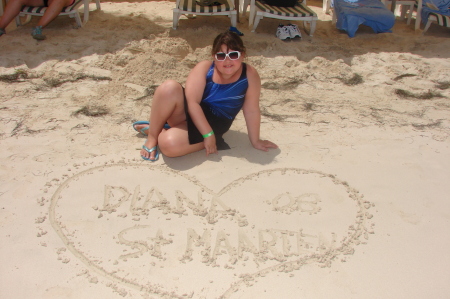 Diana signing her name on the Beach 08