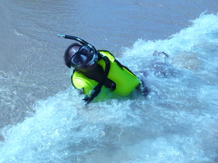 Tia playing in the water in Haiti