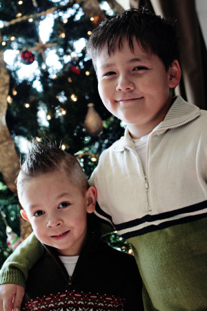 Both kids by the Christmas tree