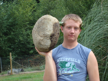 Wes working out (moving rocks).