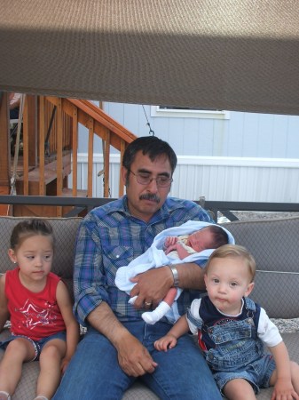 My husband Tommy with 3 of the grandkids