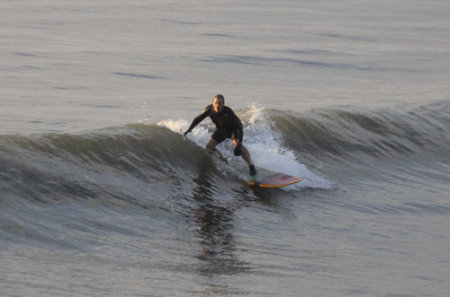 surfing at Jax Pier