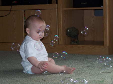 Layne playing with bubbles
