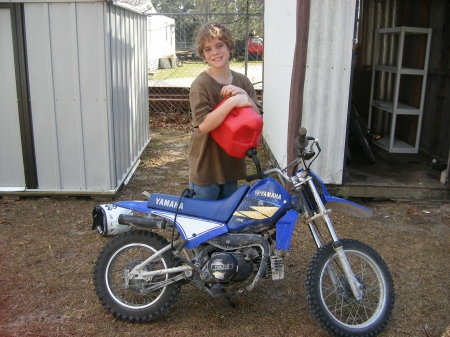 Anthony being a boy with his bike