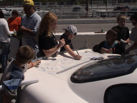 kids signing car at media day at fairgrounds .