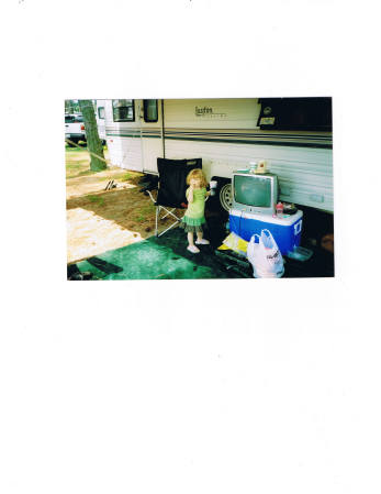 kelsey  getting a drink outside of the camper