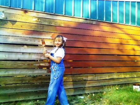 Miss Britt Painting the side of the Barn Red!