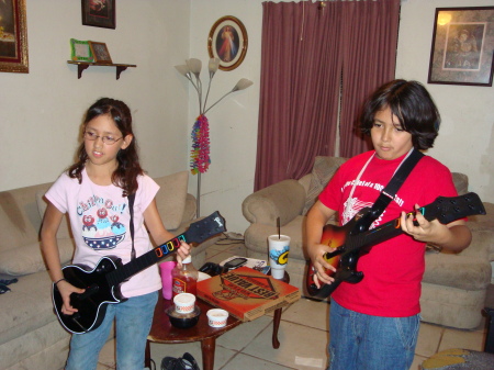 Joey and Ravyn playing Guitar Hero