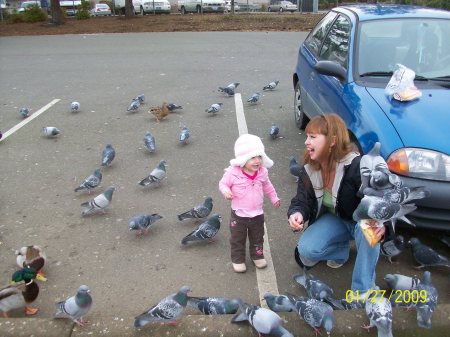 me and my granddaughter feeding the birds