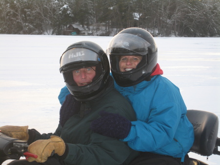 My husband and I snowmobiling on Post Lake