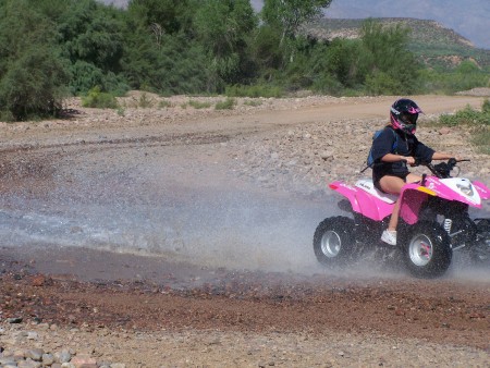 Bridget on her ATV at our Lake house