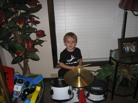 Grandson Andrew playing the drums