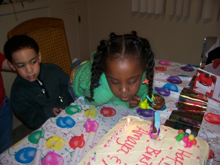 Amaya Blowing out the candles on the cake