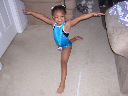 Talia posing in a split after her competition