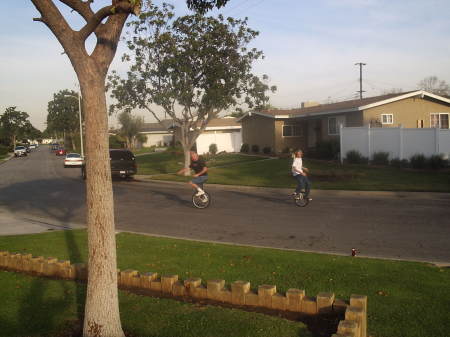 Tim And Dylan on unicycles