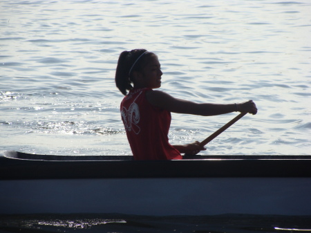 Jessica paddleing outrigger canoe.