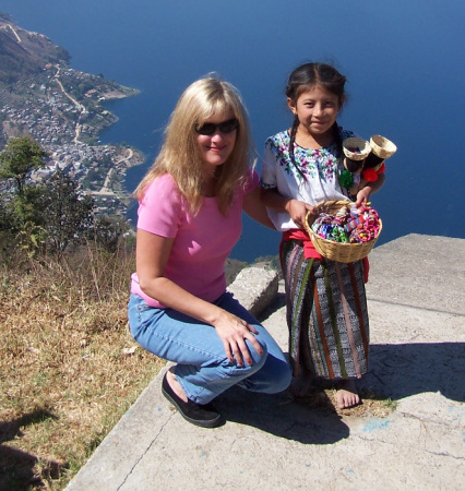 Guatemalan girl selling dolls