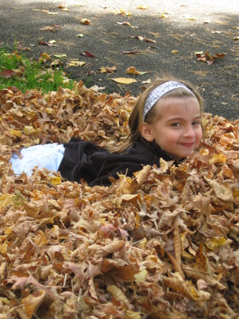 Rachael playing in the leaves