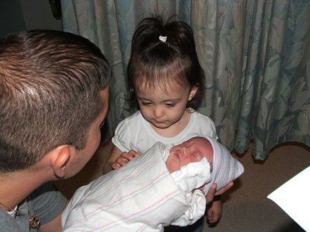 Holding new Sister for the first time....