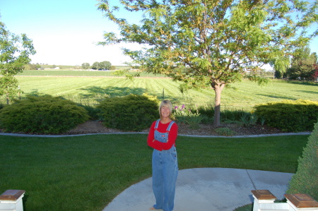 Wife Sharon in front of retirement home in Ida