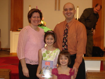 Sydney receiving her bible from church - 2009