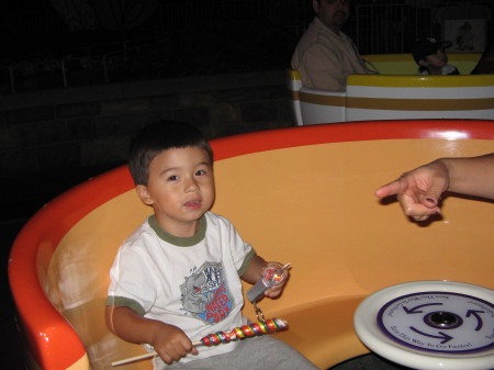 Matthew on the tea cups at disneyland