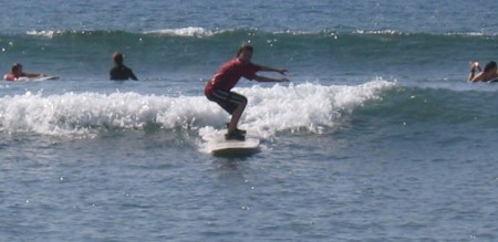 Daughter surfing, Maui