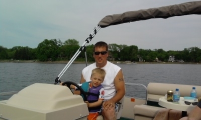 Trenton and Steve driving boat