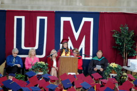 Amanda giving a speech at her graduation