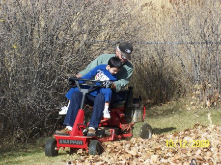 PAPPA AND BRODY CLEANING UP THE LEAVES