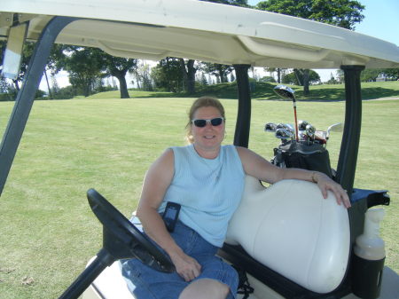 Lynn in the golf cart