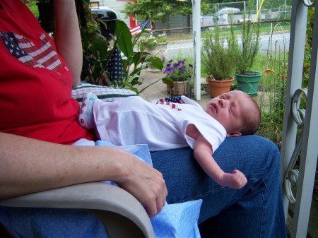 He looks very comfy on his grandmother's lap.