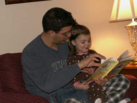 Uncle Toma reads to Sage