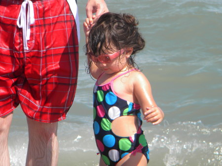 Natalie at the beach with daddy