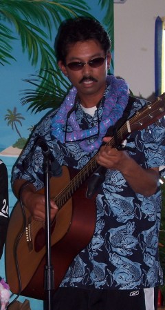 playing guitar at a luau